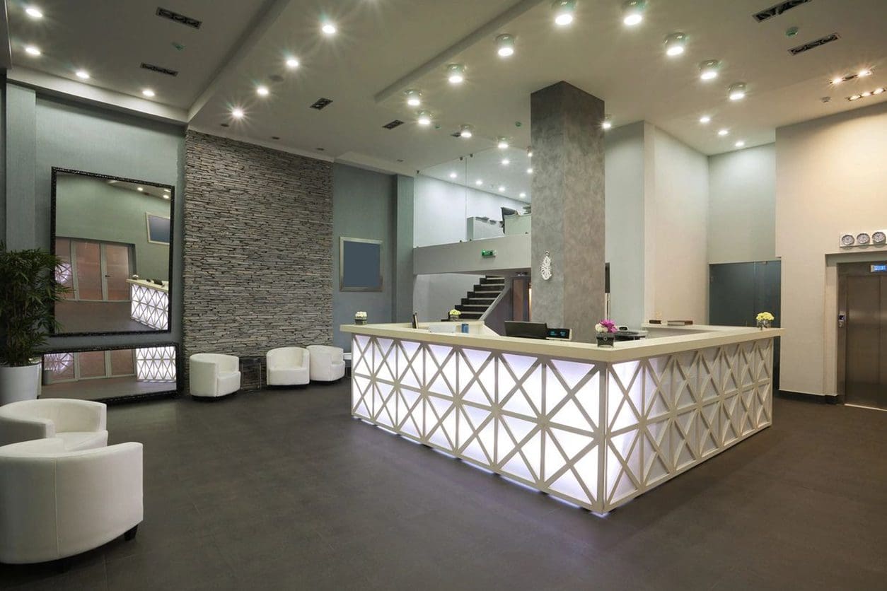 A reception area with a large white counter.